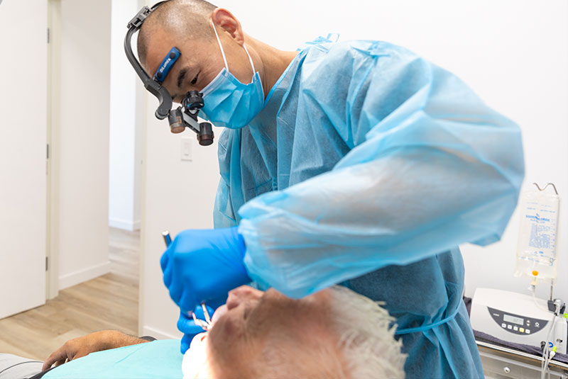 Patient performing dental procedure on patient