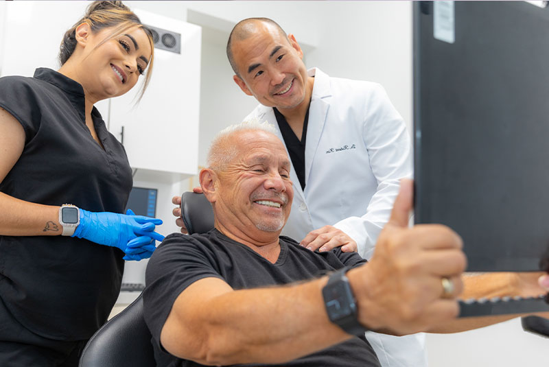 Patient smiling confidently after their dental procedure