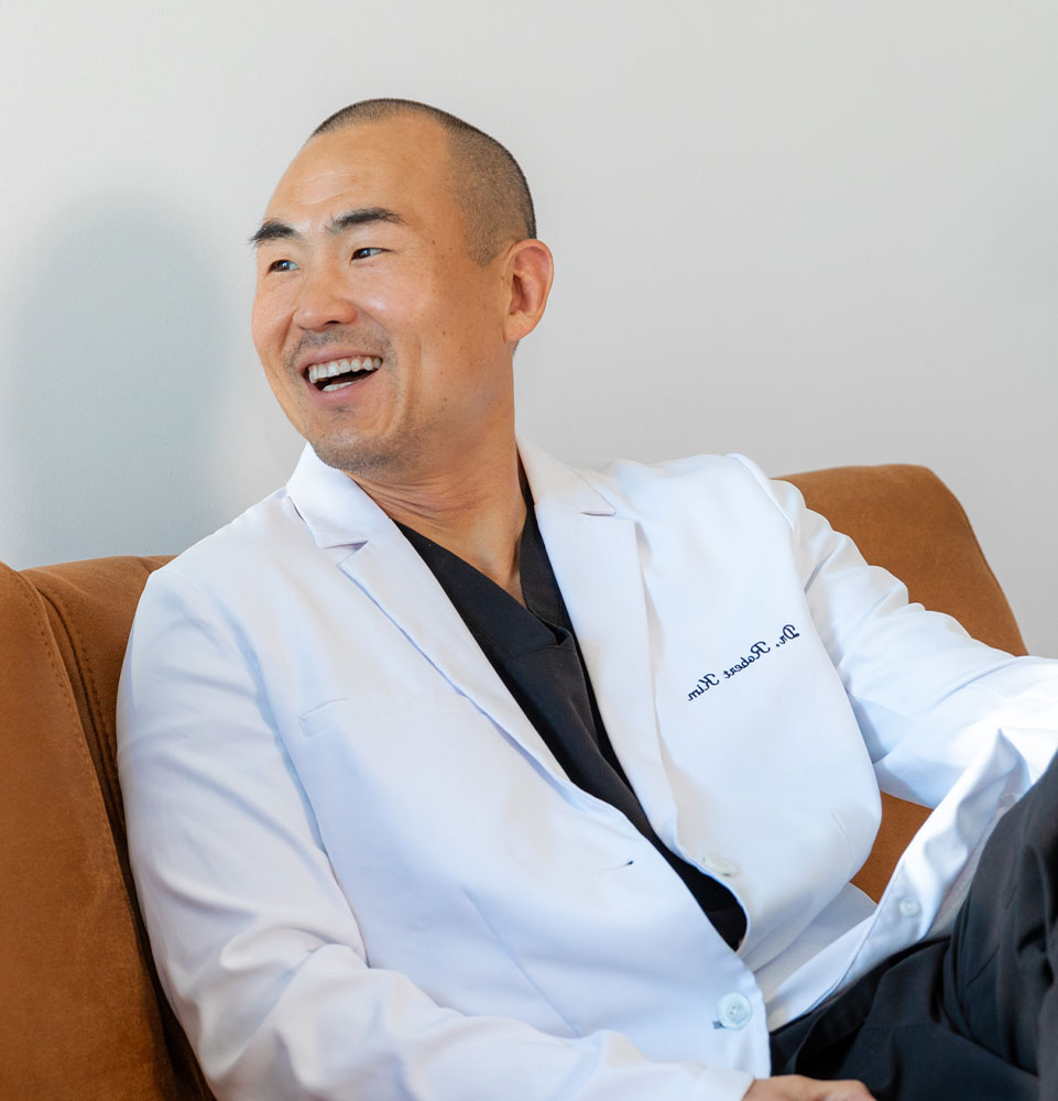 headshot of doctor talking of patient within the dental practice